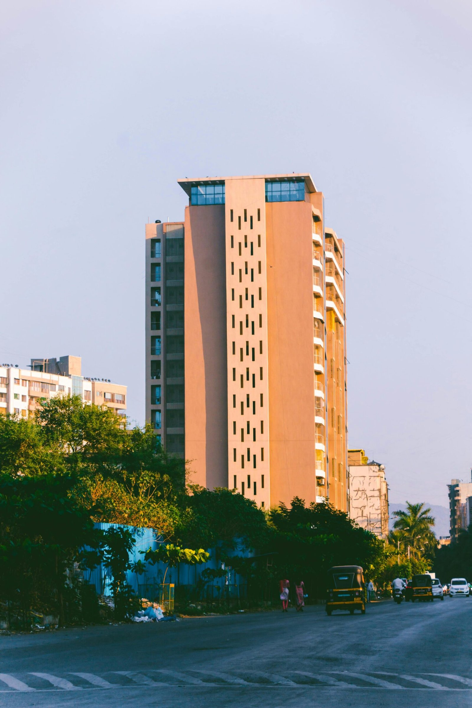 A modern residential building in an urban setting captured in daylight.